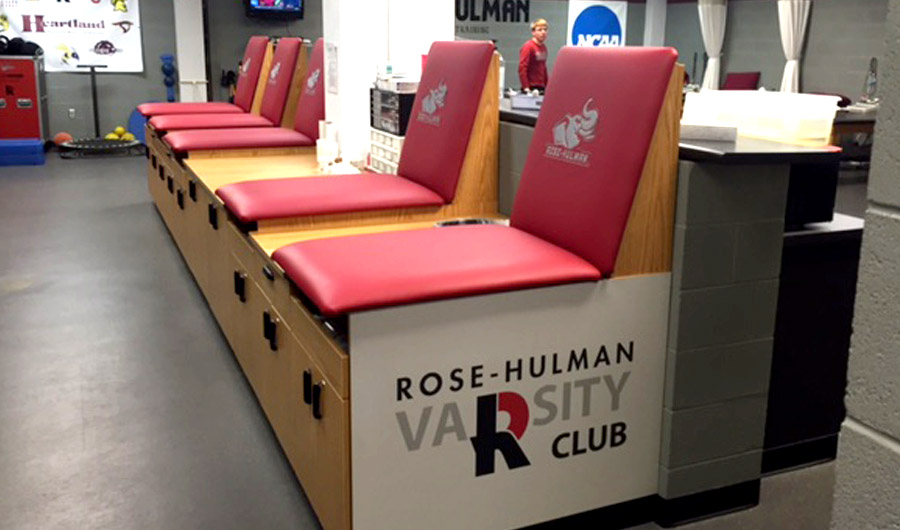 Image shows the athletic training room and the Varsity R Club logo on the equipment.